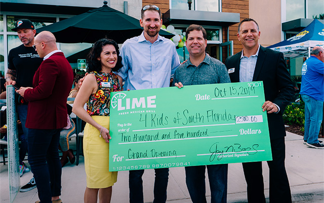 LIME give back program presents check to local organization